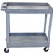 A gray Luxor utility cart with two shelves and wheels.