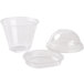 A group of Squat clear plastic cups with Fabri-Kal lids.