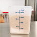 A Cambro translucent polypropylene square food storage container with measurements on it.
