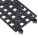 Black plastic San Jamar Versa-Mat bar mat strips with a grid of holes.