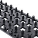 A black plastic grid with holes designed to interlock - San Jamar Versa-Mat bar mat strips