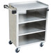 A Lakeside stainless steel utility cart with enclosed base and three shelves on wheels.
