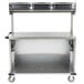 A Lakeside stainless steel vending cart with black plastic bins on a shelf.