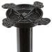 A black cast iron bar height table base with a round column and four holes.