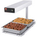 A Hatco portable heated shelf with trays of meatballs and other food on it.