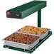 A Hatco heated food warmer with trays of meatballs and chicken on a counter.