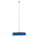 A blue broom with a white pole.