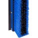 A Carlisle blue and black push broom with squeegee attachment.