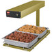 A Hatco portable food warmer with trays of meatballs and chicken on a heated shelf.
