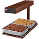 A Hatco copper heated shelf with trays of meatballs and meatballs in a tray.