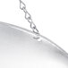 A silver pan hanging from a chain with double dials.