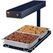 A Hatco navy portable heated shelf with trays of meatballs and chicken.