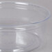 A Fabri-Kal clear plastic deli container with a clear lid on a white surface.
