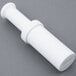 A white plastic tube from a Globe Chefmate #12 Meat Grinder.