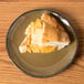 A slice of pie on a Tuxton Artisan Mojave china plate with a fork.