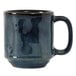 A close-up of a blue Tuxton Yukon china mug with a black handle.