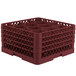 A red plastic Vollrath Traex glass rack with 12 compartments and holes.