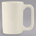 A white Tuxton Vista China mug with a handle.
