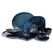 A Tuxton TuxTrendz Artisan Night Sky blue china tea set with a teapot, cup, and plate.