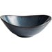 A close-up of a Tuxton TuxTrendz Artisan Night Sky bowl with a curved edge and speckled surface.