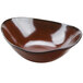 A brown Tuxton china bowl with a black rim.