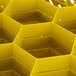 A yellow Vollrath Traex glass rack with compartments and a lid.