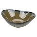 A Tuxton TuxTrendz Capistrano bowl with a black and green rim and curved edge.
