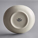 A white Tuxton oval china bowl.