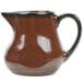 A brown pitcher with a handle on a white background.