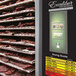 A stainless steel Excalibur dehydrator rack with meat drying.