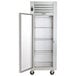 A white Traulsen G Series reach-in refrigerator with a left-hinged glass door open.