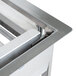 A Lakeside stainless steel tray rack dispenser on a metal table.