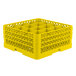 A yellow Vollrath Traex glass rack with 16 compartments.