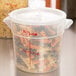 A close-up of a Cambro translucent plastic container with pasta in it.