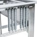 A Lakeside stainless steel glass rack dispenser on a metal table with springs.