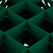 A green plastic grid with many squares and holes.