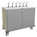 A stainless steel Lakeside serving cart with four condiment taps.