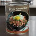 A Vanee #10 can of corned beef hash on a table.
