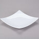 A white square Thunder Group melamine plate with a curved edge.