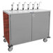 A stainless steel Lakeside serving cart with eight metal pumps for condiments.