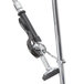 A metal Equip by T&S pre-rinse faucet pole with a handle and hose.