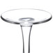An Arcoroc champagne flute with a clear glass stem and round bottom.