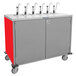 A red and grey Lakeside serving cart with four metal taps.
