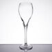 An Arcoroc Malea flute wine glass on a table.