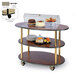 A Geneva oval serving cart with a tray of desserts on it.