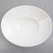 A white Whittier porcelain shallow oval bowl.