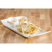 A white rectangular porcelain platter with chips and dip on it.
