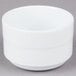 An Arcoroc white Rondo bouillon cup on a gray surface.