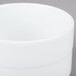 An Arcoroc white bouillon cup.