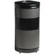 A black and silver Rubbermaid Classics trash can with holes on the top.